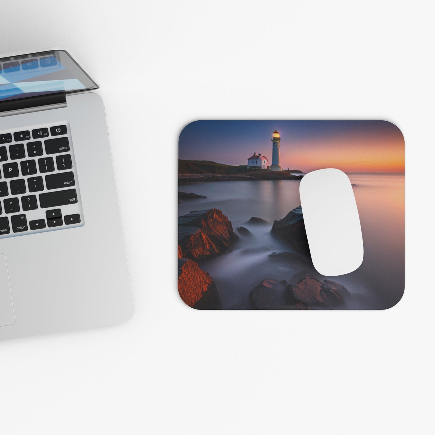 Lighthouse bathing in the sun mouse pad